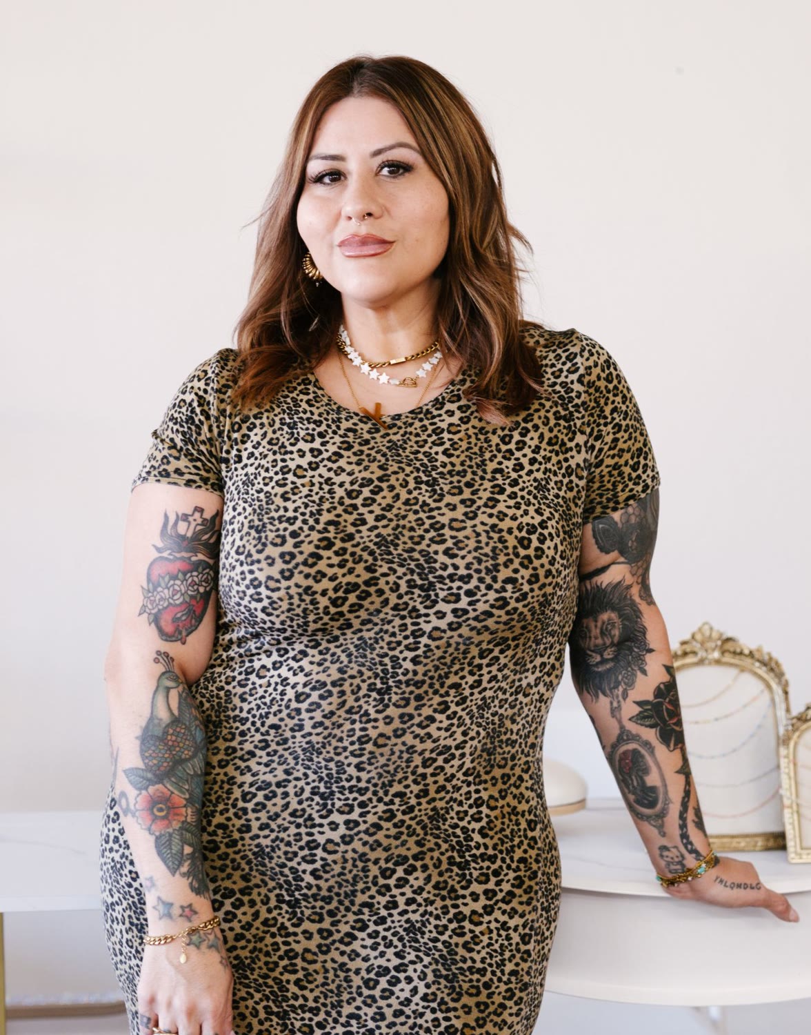 Karina Zujey in a leopard print dress in her suite